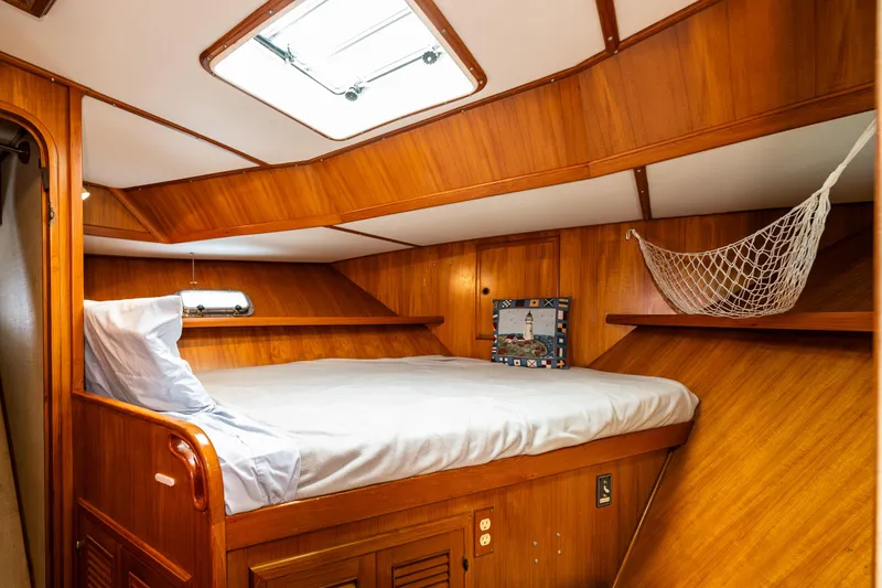 Slide: The Image of Cozy cabin interior of 1986 Kha Shing 37' yacht with wooden finish and bed. - 33