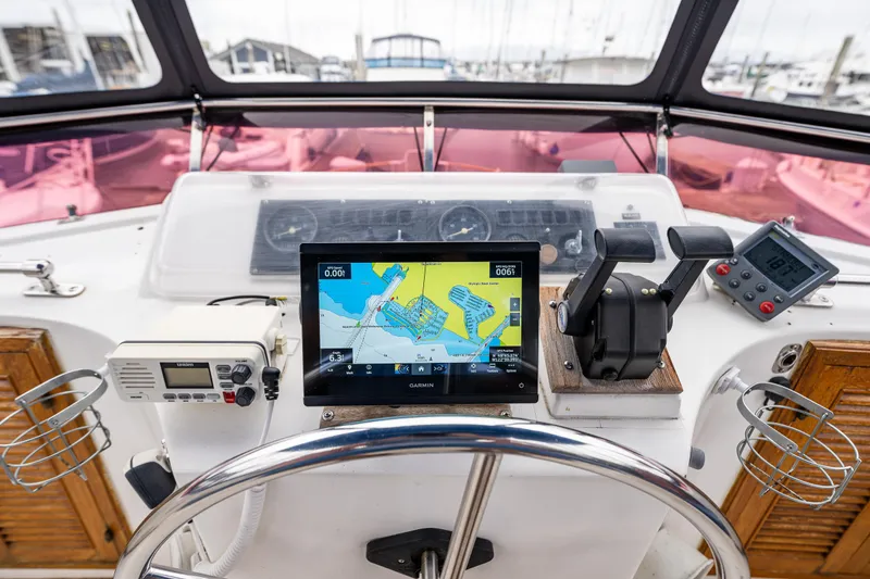 Slide: The Image of Cockpit of 1986 Kha Shing 37' yacht with navigation equipment and steering wheel. - 46
