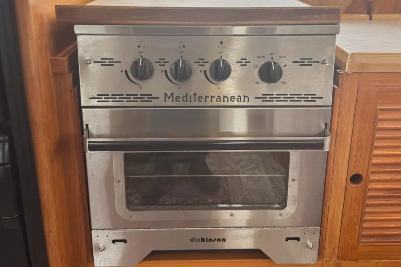 Slide: The Image of Stainless steel Mediterranean oven in 1986 Kha Shing 37' yacht kitchen. - 49