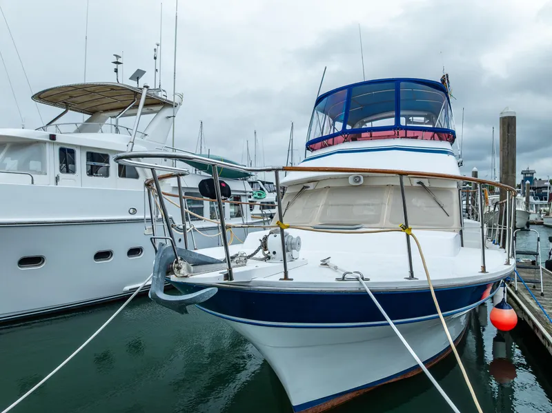 Slide: The Image of 1986 Kha Shing 37' yacht docked at marina on a cloudy day. - 8