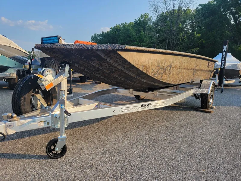 Slide: The Image of 2025 Xpress XTS16 duck hunting boat with Yamaha 50 hp engine on trailer. - 10