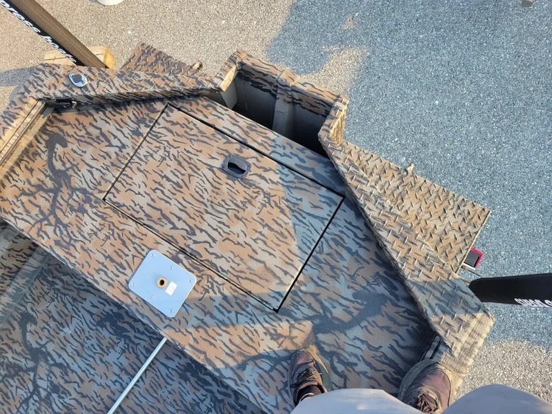 Slide: The Image of 2025 Xpress XTS16 duck hunting boat with camouflage pattern and Yamaha 50 hp engine. - 11