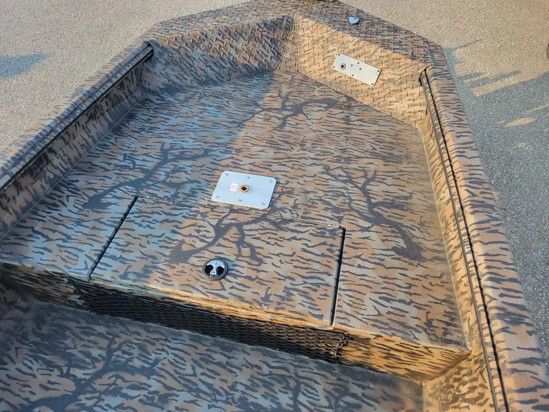 Slide: The Image of 2025 Xpress XTS16 duck hunting boat with camouflage interior design. - 6