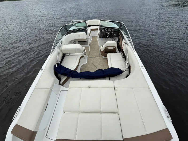 Slide: The Image of 2018 Cobalt 220S boat with spacious seating on calm water. - 12