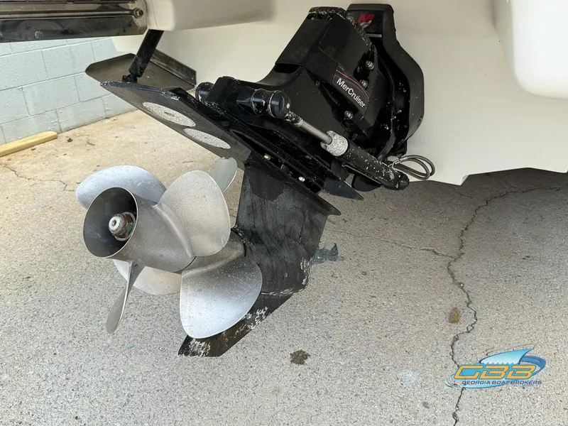 Slide: The Image of 2008 Sea Ray 270 SLX boat propeller and outdrive on concrete surface. - 10