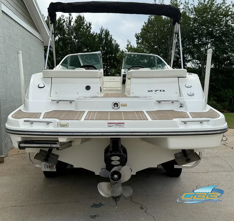 Slide: The Image of 2008 Sea Ray 270 SLX boat, rear view with dual propellers and swim platform. - 11