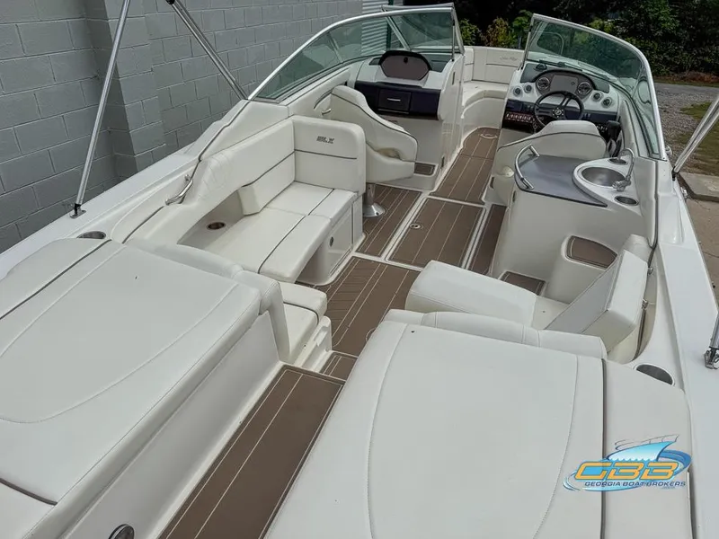 Slide: The Image of 2008 Sea Ray 270 SLX boat interior with white seating and brown flooring. - 14