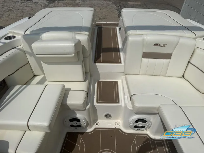 Slide: The Image of 2008 Sea Ray 270 SLX boat interior with white seating and brown accents. - 24