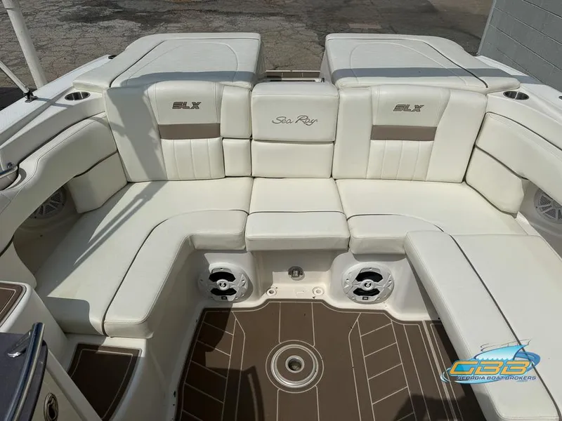 Slide: The Image of 2008 Sea Ray 270 SLX boat interior with white seating and brown flooring. - 25