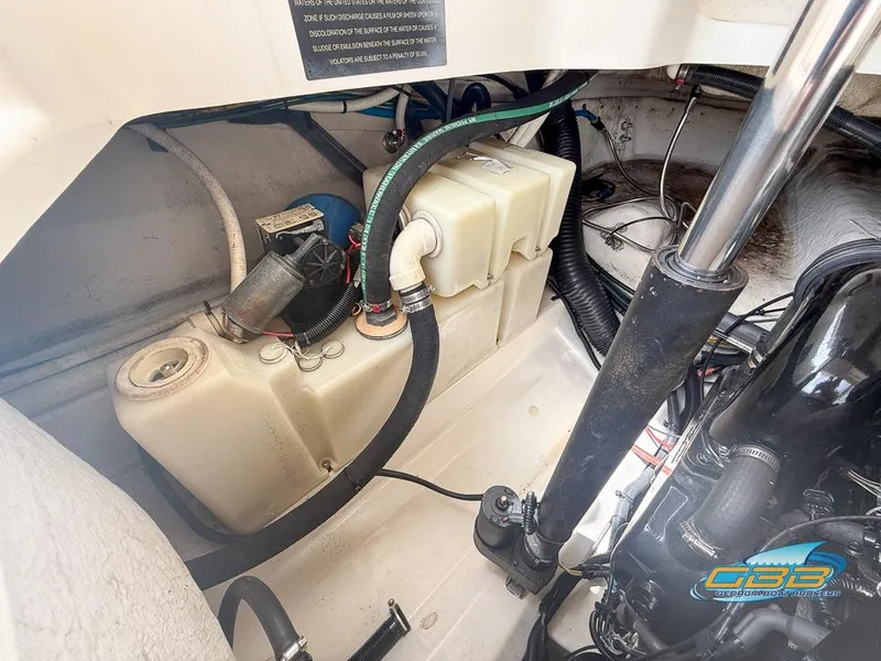 Slide: The Image of Engine compartment of a 2008 Sea Ray 270 SLX boat, showing mechanical components and fluid reservoirs. - 27