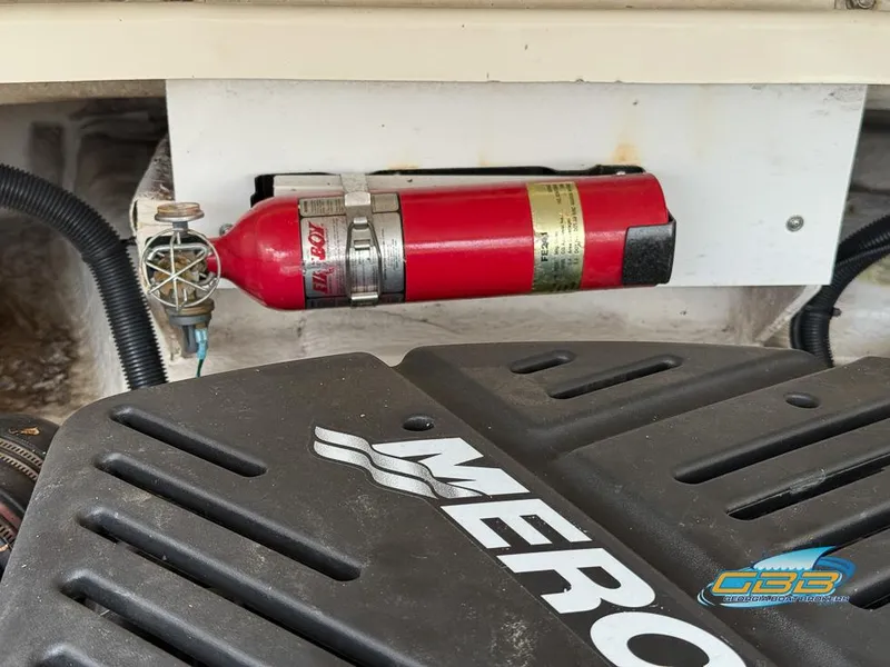 Slide: The Image of Engine compartment of 2008 Sea Ray 270 SLX with fire extinguisher and MerCruiser engine cover. - 28