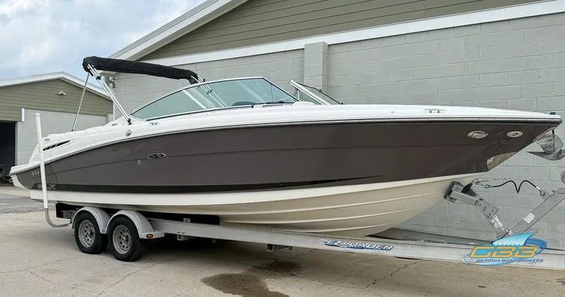 Slide: The Image of 2008 Sea Ray 270 SLX boat on trailer, parked outside a building. - 3