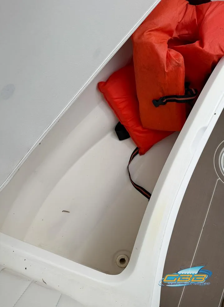 Slide: The Image of Storage compartment in 2008 Sea Ray 270 SLX boat with orange life jackets. - 34