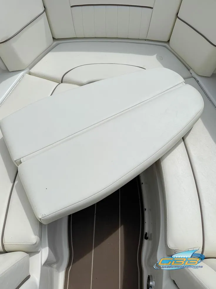 Slide: The Image of 2008 Sea Ray 270 SLX boat interior with white cushioned seating. - 35