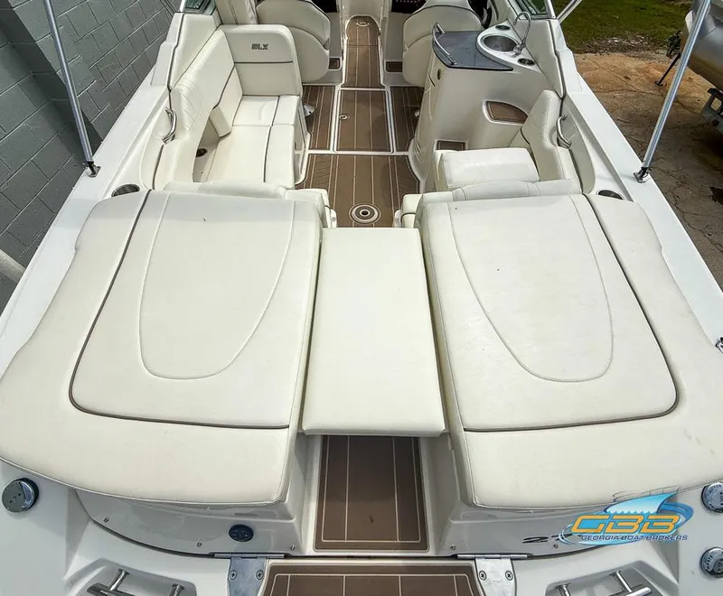Slide: The Image of 2008 Sea Ray 270 SLX boat interior with white seating and wood accents. - 37