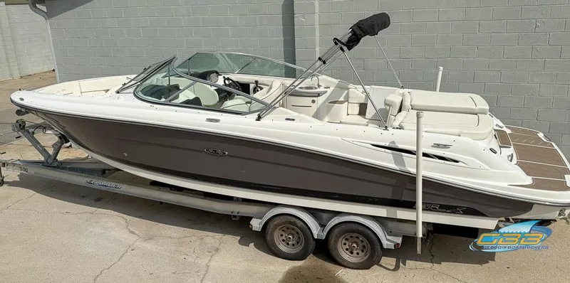 Slide: The Image of 2008 Sea Ray 270 SLX boat on trailer, parked outdoors, side view. - 4