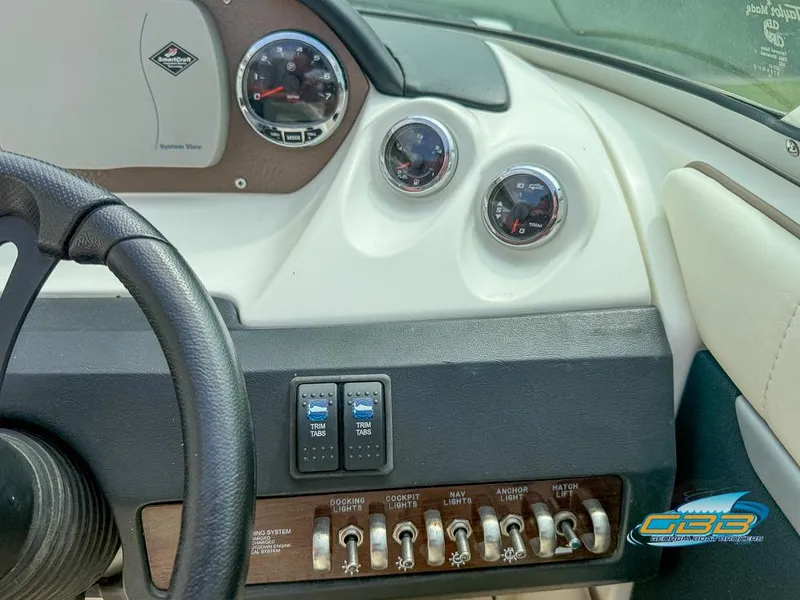 Slide: The Image of Dashboard of a 2008 Sea Ray 270 SLX boat with gauges and controls. - 42