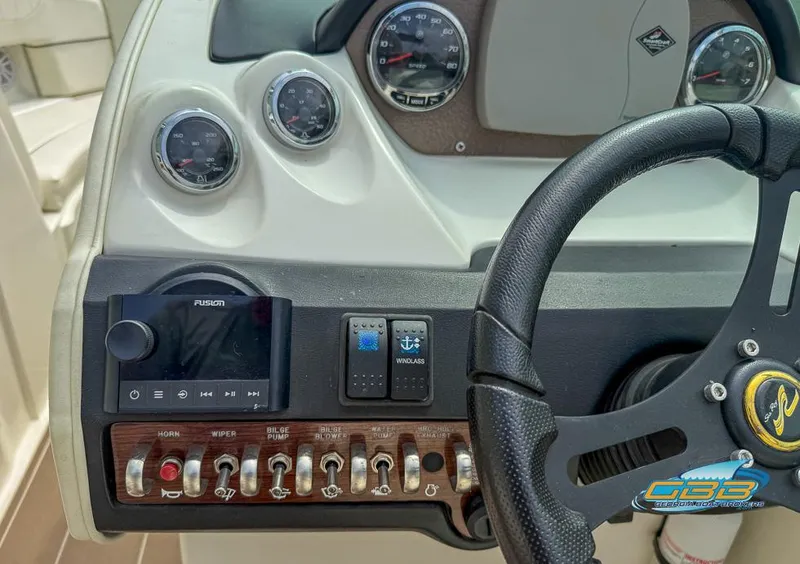Slide: The Image of Dashboard of 2008 Sea Ray 270 SLX boat with steering wheel and control panel. - 43