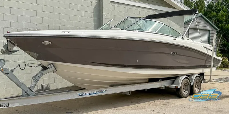 Slide: The Image of 2008 Sea Ray 270 SLX boat on trailer, parked outdoors. - 5