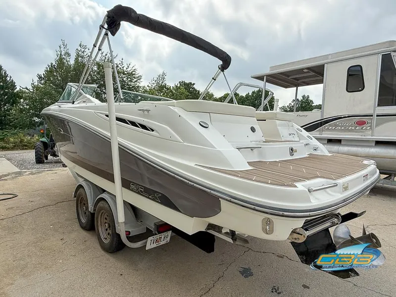 Slide: The Image of 2008 Sea Ray 270 SLX boat on trailer, rear view, parked outdoors. - 8