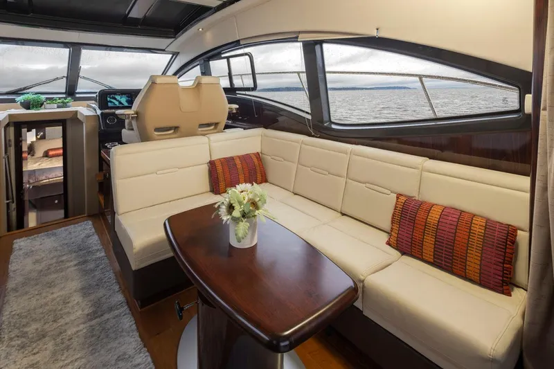 Slide: The Image of Luxurious interior of 2016 Sea Ray 400 Sundancer yacht with plush seating and elegant decor. - 21
