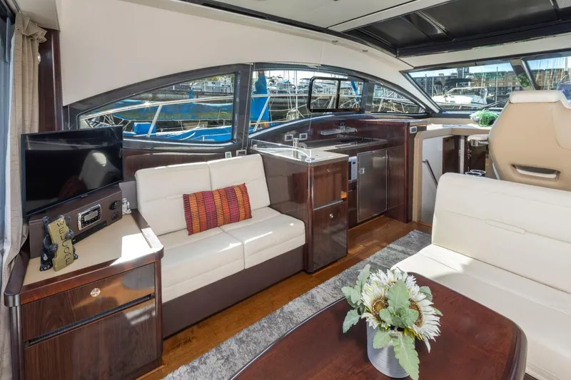 Slide: The Image of Luxurious interior of 2016 Sea Ray 400 Sundancer yacht with elegant seating and modern amenities. - 25