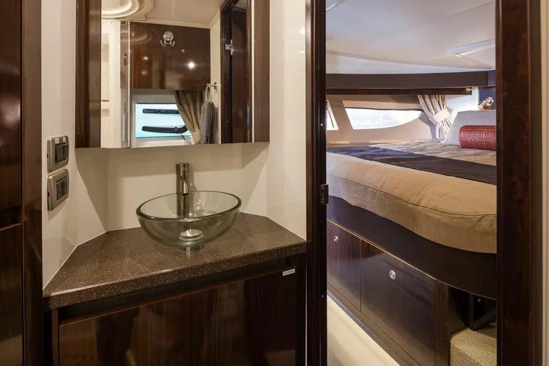 Slide: The Image of Luxurious interior of 2016 Sea Ray 400 Sundancer yacht with modern bathroom and cozy bedroom. - 35