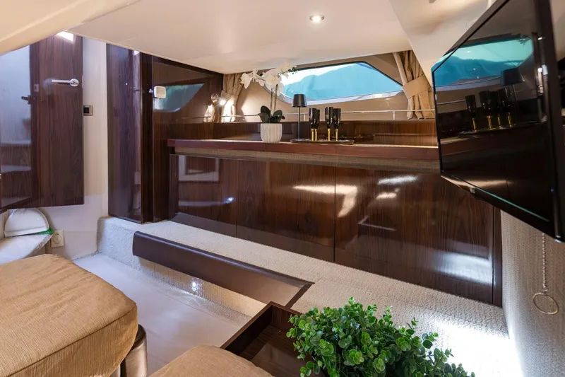 Slide: The Image of Luxurious interior of 2016 Sea Ray 400 Sundancer yacht with elegant wood finishes. - 39