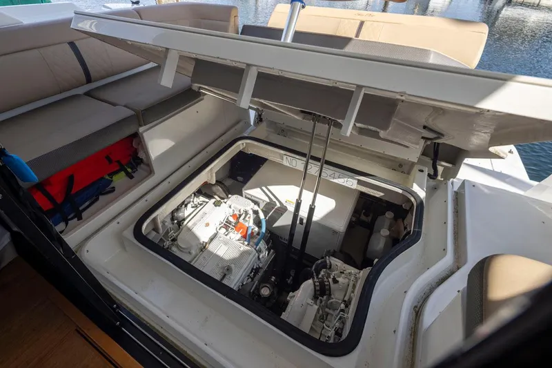 Slide: The Image of Engine compartment of 2016 Sea Ray 400 Sundancer yacht, showcasing mechanical components. - 47