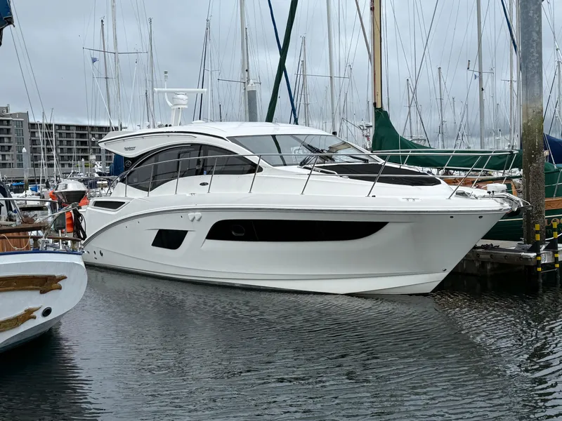 Slide: The Image of 2016 Sea Ray 400 Sundancer yacht docked in a marina. - 50