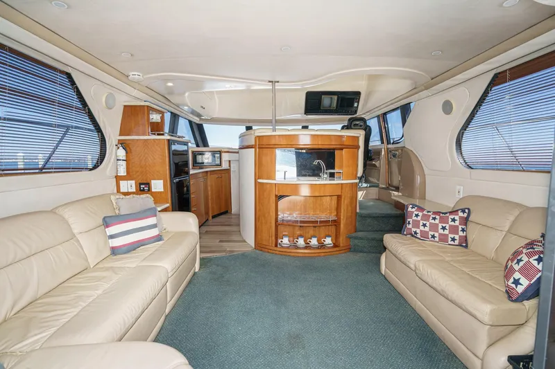 Slide: The Image of Luxurious interior of 2000 Carver 450 Voyager Pilothouse with plush seating and modern amenities. - 2