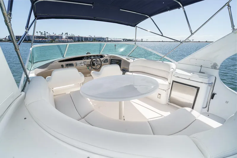 Slide: The Image of Luxurious 2000 Carver 450 Voyager Pilothouse yacht interior with seating and helm. - 28