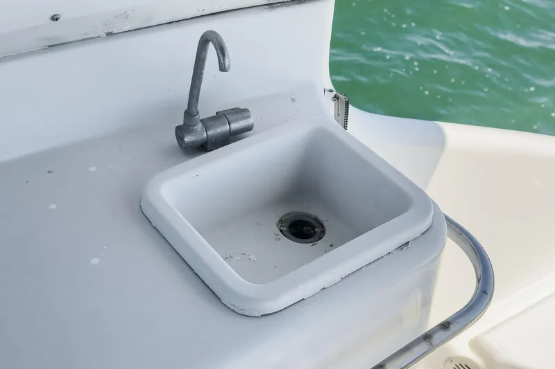 Slide: The Image of Sink and faucet on 2000 Carver 450 Voyager Pilothouse yacht, overlooking water. - 29