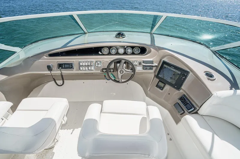 Slide: The Image of Pilothouse of 2000 Carver 450 Voyager, featuring modern controls and ocean view. - 31