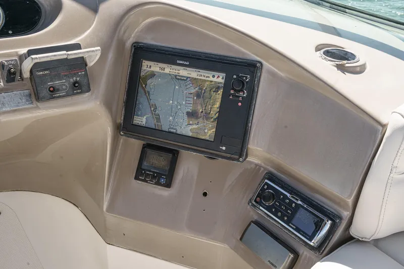 Slide: The Image of Control panel of 2000 Carver 450 Voyager Pilothouse with navigation display and controls. - 32