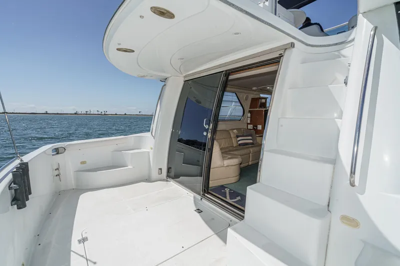 Slide: The Image of 2000 Carver 450 Voyager Pilothouse yacht with open deck and luxurious interior view. - 34