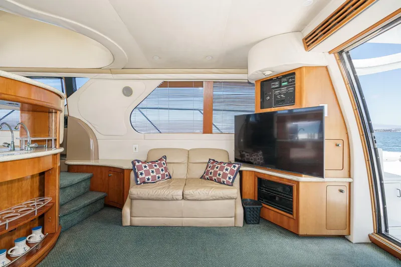 Slide: The Image of Luxurious interior of 2000 Carver 450 Voyager Pilothouse with sofa, TV, and kitchenette. - 39