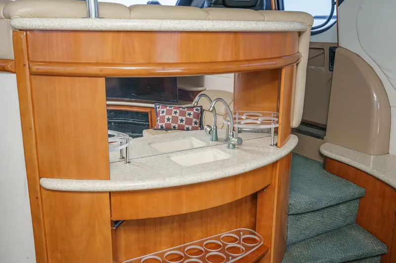 Slide: The Image of Interior of 2000 Carver 450 Voyager Pilothouse with wooden cabinetry and sink area. - 40