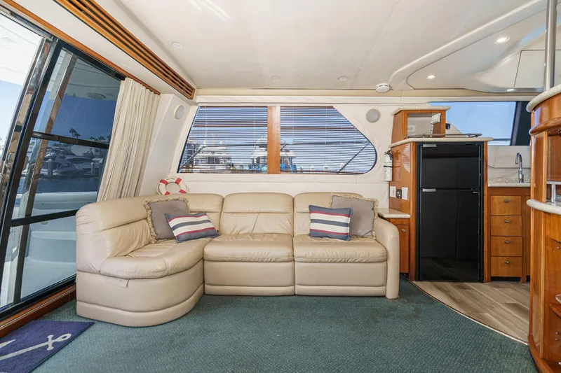 Slide: The Image of Interior of 2000 Carver 450 Voyager Pilothouse with leather sofa and kitchenette. - 41