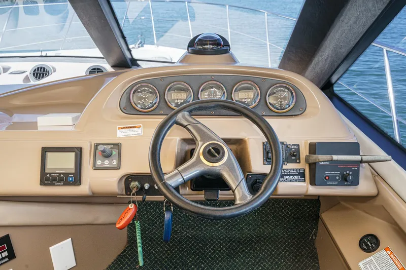 Slide: The Image of Pilothouse of 2000 Carver 450 Voyager with steering wheel and control panel. - 47