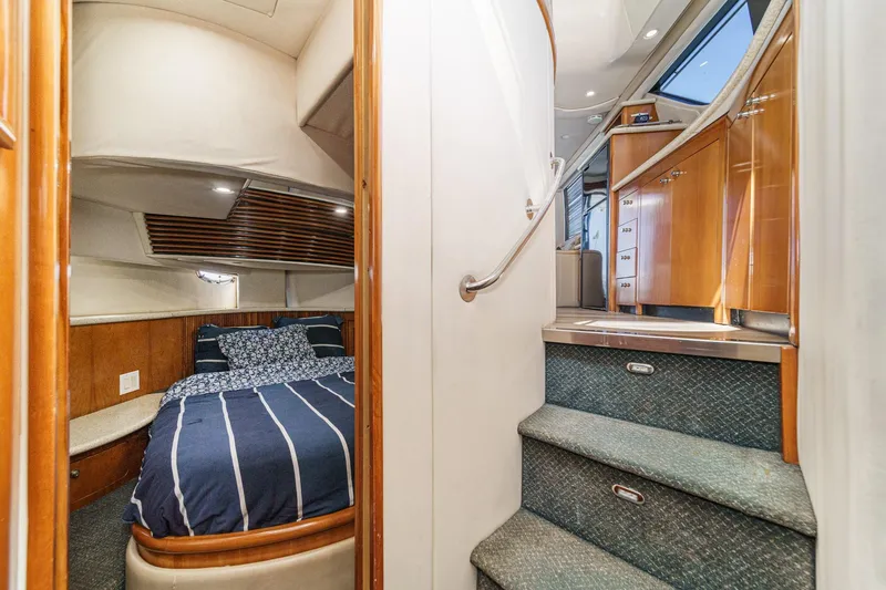 Slide: The Image of Interior of 2000 Carver 450 Voyager Pilothouse with cozy bedroom and elegant staircase. - 53