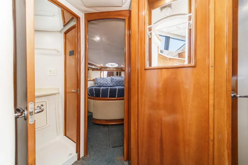 Slide: The Image of Interior of 2000 Carver 450 Voyager Pilothouse with wood finishes and cozy bedroom. - 56