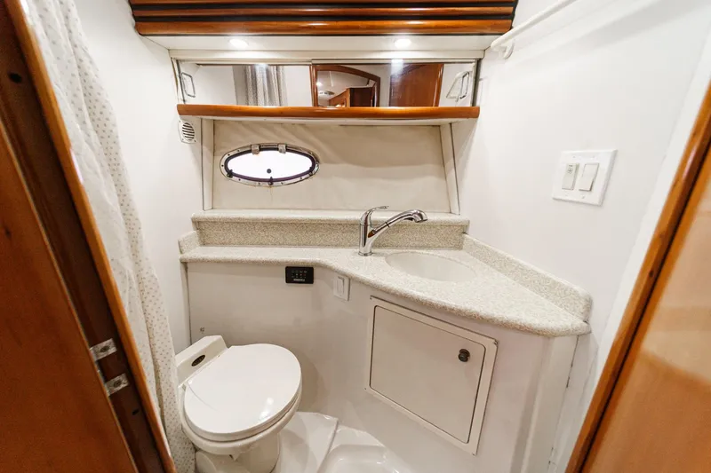 Slide: The Image of Bathroom interior of 2000 Carver 450 Voyager Pilothouse yacht with sink and toilet. - 60