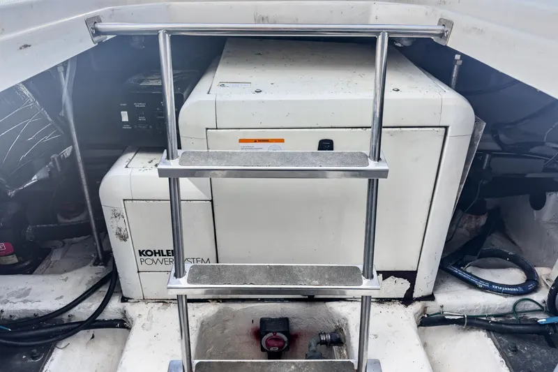 Slide: The Image of Engine room of 2000 Carver 450 Voyager Pilothouse with Kohler power system and ladder. - 64