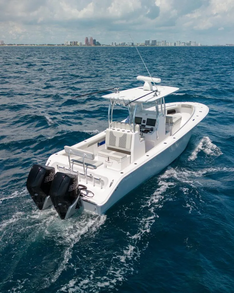 Slide: The Image of 2026 Front Runner 33 Center Console boat cruising on open ocean waters. - 3