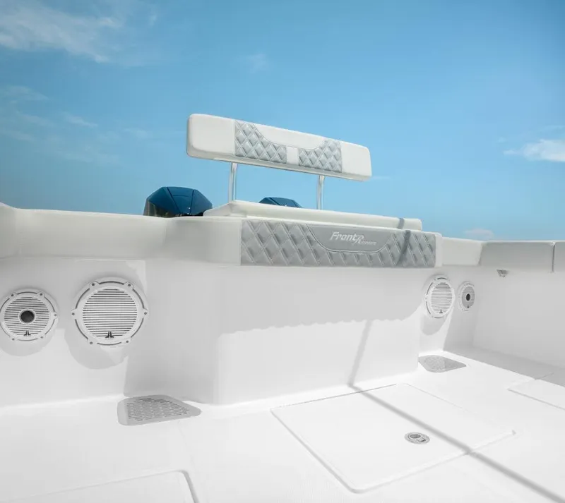 Slide: The Image of 2026 Front Runner 33 Center Console boat interior with speakers and cushioned seating. - 8