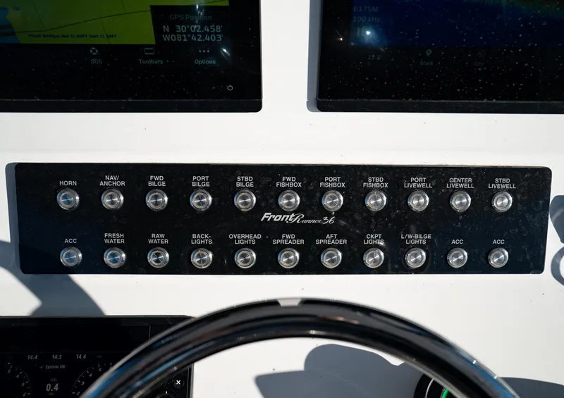 Slide: The Image of Control panel of 2026 Front Runner 36 Center Console boat with labeled switches. - 15