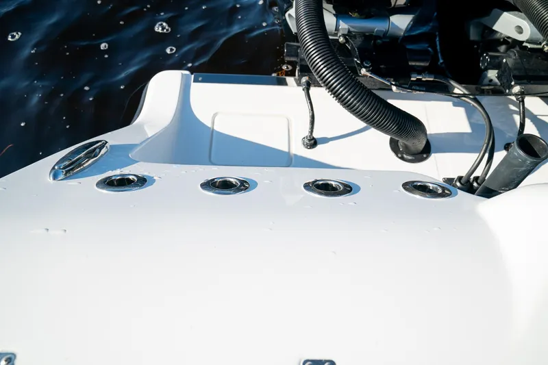 Slide: The Image of 2026 Front Runner 36 Center Console boat detail with water droplets and engine components. - 26