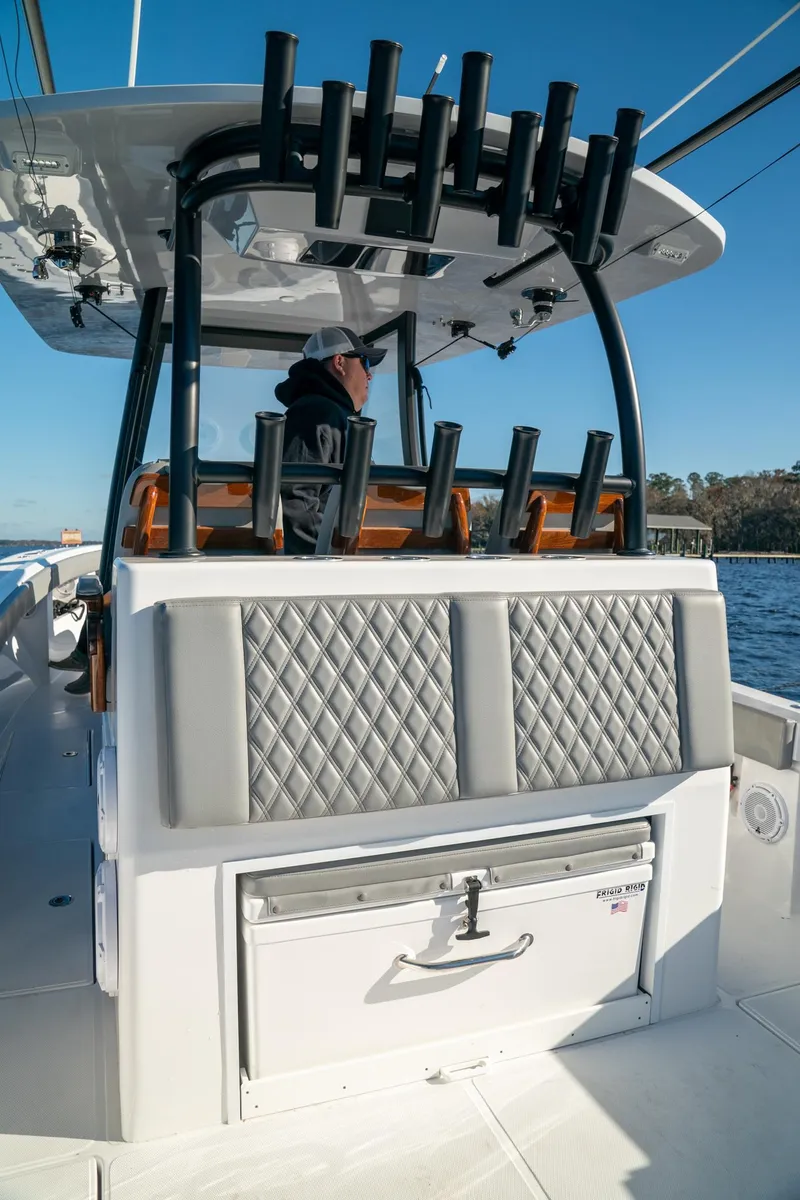 Slide: The Image of 2026 Front Runner 36 Center Console boat with rod holders, quilted seats, and storage, on open water. - 28