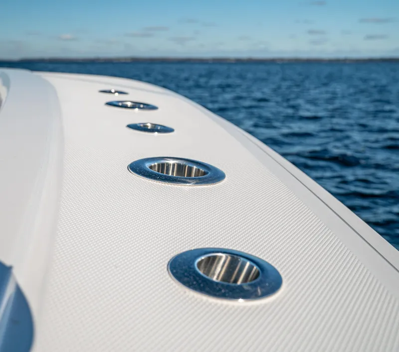 Slide: The Image of 2026 Front Runner 36 Center Console boat detail with ocean backdrop. - 7